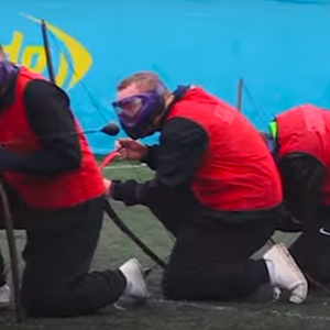Several Man Playing Combat Archery Tag